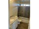 Bathroom with tub shower combo and granite countertop at 25627 W Hedgehog Rd, Wittmann, AZ 85361