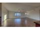 Open living room with tile flooring and natural light at 25627 W Hedgehog Rd, Wittmann, AZ 85361