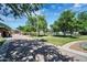 Community playground with play structures and covered seating at 40718 N Copper Basin Trl, Phoenix, AZ 85086