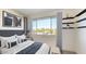 Bright bedroom with a comfortable bed and a view of the cityscape at 4444 N 25Th St # 15, Phoenix, AZ 85016