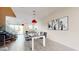 Modern dining area with white table, black chairs, and red pendant lights at 4444 N 25Th St # 15, Phoenix, AZ 85016
