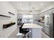 Modern kitchen with gray cabinets, quartz countertops, and stainless steel appliances at 4444 N 25Th St # 15, Phoenix, AZ 85016