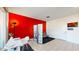 Small home office with white desk and red accent wall at 4444 N 25Th St # 15, Phoenix, AZ 85016