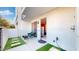 Private patio with artificial turf and seating area at 4444 N 25Th St # 15, Phoenix, AZ 85016