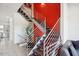 Modern open staircase with metal railing and red accent wall at 4444 N 25Th St # 15, Phoenix, AZ 85016