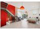 Modern open staircase with metal railing and red accent wall at 4444 N 25Th St # 15, Phoenix, AZ 85016