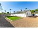 Artificial turf backyard with gravel and block wall at 4839 E Laurel Ln, Scottsdale, AZ 85254