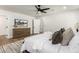 Bedroom with wood floors, ceiling fan and dresser at 4839 E Laurel Ln, Scottsdale, AZ 85254