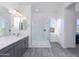 Modern bathroom with gray double vanity, quartz countertop and large walk-in shower at 562 N Sun Rd, Apache Junction, AZ 85119