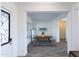 Bright entryway with gray tile floors and a wooden dining table at 562 N Sun Rd, Apache Junction, AZ 85119