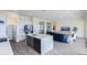 Modern kitchen with island, white cabinets and stainless steel appliances at 562 N Sun Rd, Apache Junction, AZ 85119