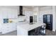 Modern kitchen with white cabinets, quartz countertops, and stainless steel appliances at 562 N Sun Rd, Apache Junction, AZ 85119