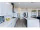 Modern kitchen with white cabinets, a large island, and stainless steel appliances at 562 N Sun Rd, Apache Junction, AZ 85119