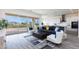 Open floor plan with a navy sofa and a view of the kitchen at 562 N Sun Rd, Apache Junction, AZ 85119