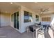 Outdoor patio with seating area, ceiling fan, and city views at 7031 W Jasper Dr, Chandler, AZ 85226