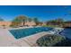 Relaxing pool area with water features and comfortable lounge chairs at 7802 W Artemisa Ave, Peoria, AZ 85383