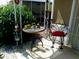 Small patio with table, chairs, and potted plants at 8103 E Southern Ave # 287, Mesa, AZ 85208