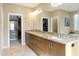 Bathroom with double vanity and walk-in closet at 8689 E Windrose Dr, Scottsdale, AZ 85260