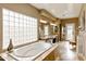 Elegant bathroom featuring a soaking tub and double vanity at 8689 E Windrose Dr, Scottsdale, AZ 85260