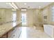 Spa-like bathroom with soaking tub and walk-in shower at 8689 E Windrose Dr, Scottsdale, AZ 85260
