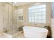 Bathroom with soaking tub and walk-in shower at 8689 E Windrose Dr, Scottsdale, AZ 85260