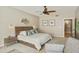 Main bedroom with large bed and sitting area at 8689 E Windrose Dr, Scottsdale, AZ 85260
