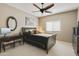 Bedroom with a sleigh bed, desk and seating at 8689 E Windrose Dr, Scottsdale, AZ 85260