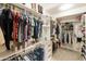 Large walk-in closet with ample hanging and shelving at 8689 E Windrose Dr, Scottsdale, AZ 85260