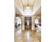 Elegant entryway with high ceilings, arched doorways and tile flooring at 8689 E Windrose Dr, Scottsdale, AZ 85260