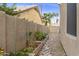 Landscaped garden with various plants in raised beds at 8689 E Windrose Dr, Scottsdale, AZ 85260