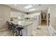 Spacious kitchen with granite counters and breakfast bar at 8689 E Windrose Dr, Scottsdale, AZ 85260