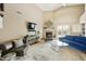 Bright living room with a fireplace and access to backyard at 8689 E Windrose Dr, Scottsdale, AZ 85260