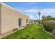 Neatly landscaped side yard with lush green grass at 8689 E Windrose Dr, Scottsdale, AZ 85260