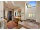 Large bathroom with soaking tub, walk-in shower, and skylight at 10040 E Happy Valley Rd # 1045, Scottsdale, AZ 85255