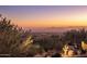 Panoramic view of city lights and mountains at sunset at 10040 E Happy Valley Rd # 1045, Scottsdale, AZ 85255