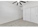 Well-lit bedroom featuring double door closet and carpet flooring at 1417 E Mark Ct, Casa Grande, AZ 85122