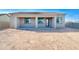 View of the home's back exterior and covered patio at 14595 S Vera Cruz Rd, Arizona City, AZ 85123