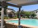 Community pool with pergola and lounge chairs at 16478 W Culver St, Goodyear, AZ 85338