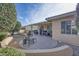 Relaxing backyard patio with seating and desert landscaping at 16824 W Palisade Trail Ln, Surprise, AZ 85387