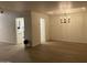 Bright dining room with hardwood floors and a modern chandelier at 1745 E Glade Ave, Mesa, AZ 85204