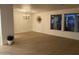 Bright dining room with hardwood floors and a modern chandelier at 1745 E Glade Ave, Mesa, AZ 85204