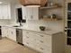 Modern kitchen with white shaker cabinets, quartz countertops, and stainless steel appliances at 1745 E Glade Ave, Mesa, AZ 85204