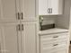 Modern kitchen with white shaker cabinets and quartz countertops at 1745 E Glade Ave, Mesa, AZ 85204