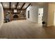 Spacious living room with a brick fireplace and hardwood floors at 1745 E Glade Ave, Mesa, AZ 85204