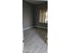 Spacious bedroom with wood-look floors and large window at 17913 W Desert View Ln, Goodyear, AZ 85338
