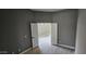 Bright bedroom with double doors and hardwood floors at 17913 W Desert View Ln, Goodyear, AZ 85338