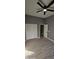 Spacious bedroom with wood-look floors and double doors at 17913 W Desert View Ln, Goodyear, AZ 85338