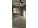 Bedroom with wood-look floors, ceiling fan, and window at 17913 W Desert View Ln, Goodyear, AZ 85338