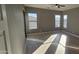 Spacious bedroom with light wood floors and ceiling fan at 17913 W Desert View Ln, Goodyear, AZ 85338