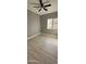 Spacious bedroom with wood-look floors and ceiling fan at 17913 W Desert View Ln, Goodyear, AZ 85338